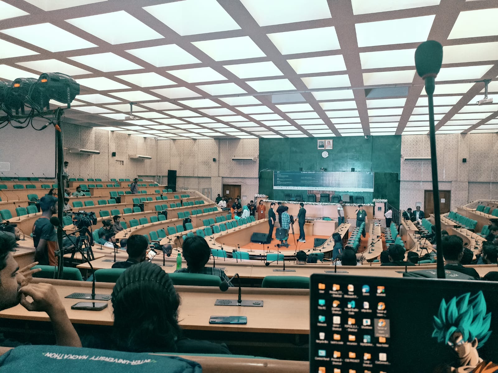 The closing ceremony of the inter-university hackathon in a full auditorium.