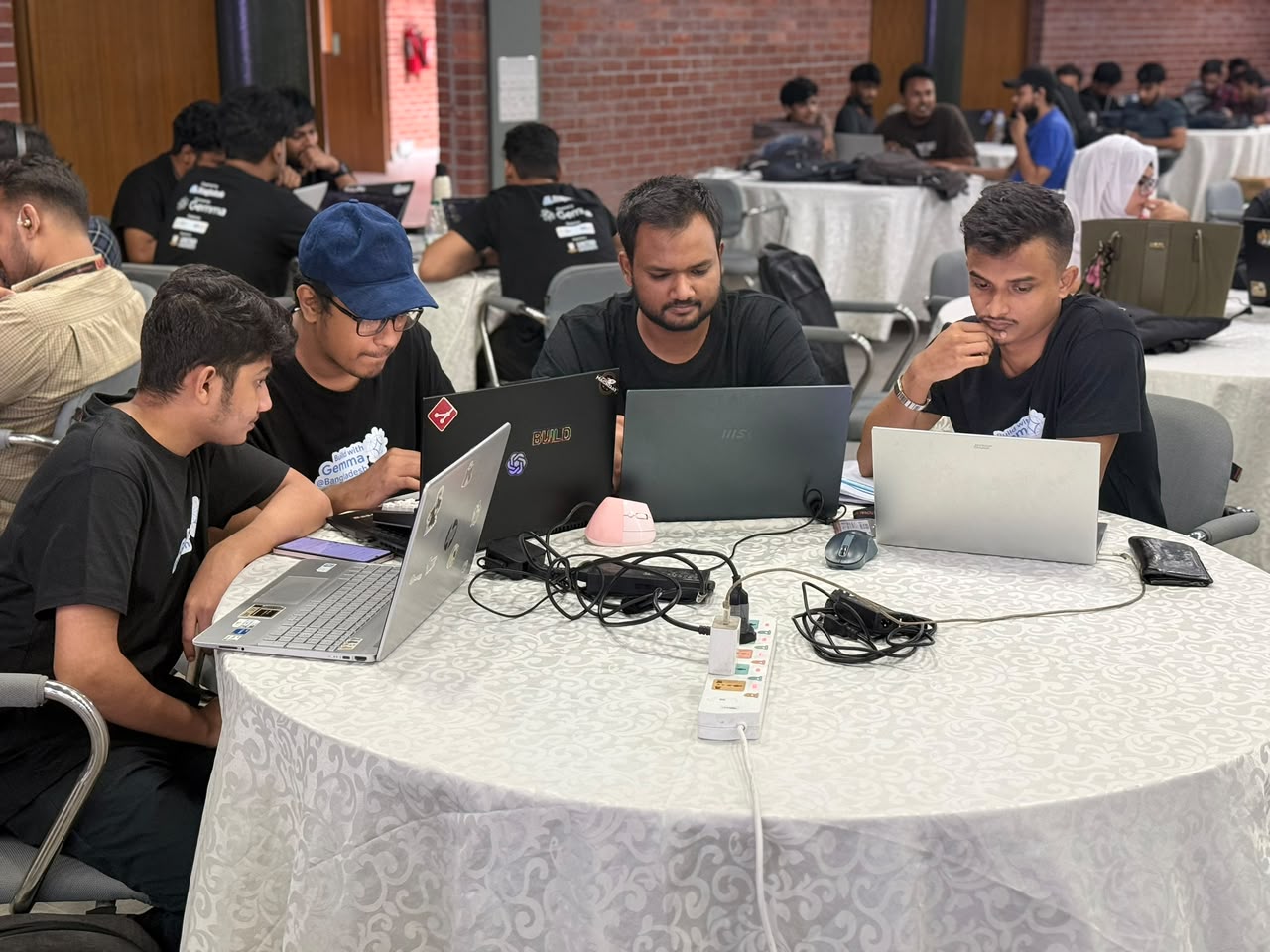 Team Ascent working on laptops during the Build with Gemma hackathon.